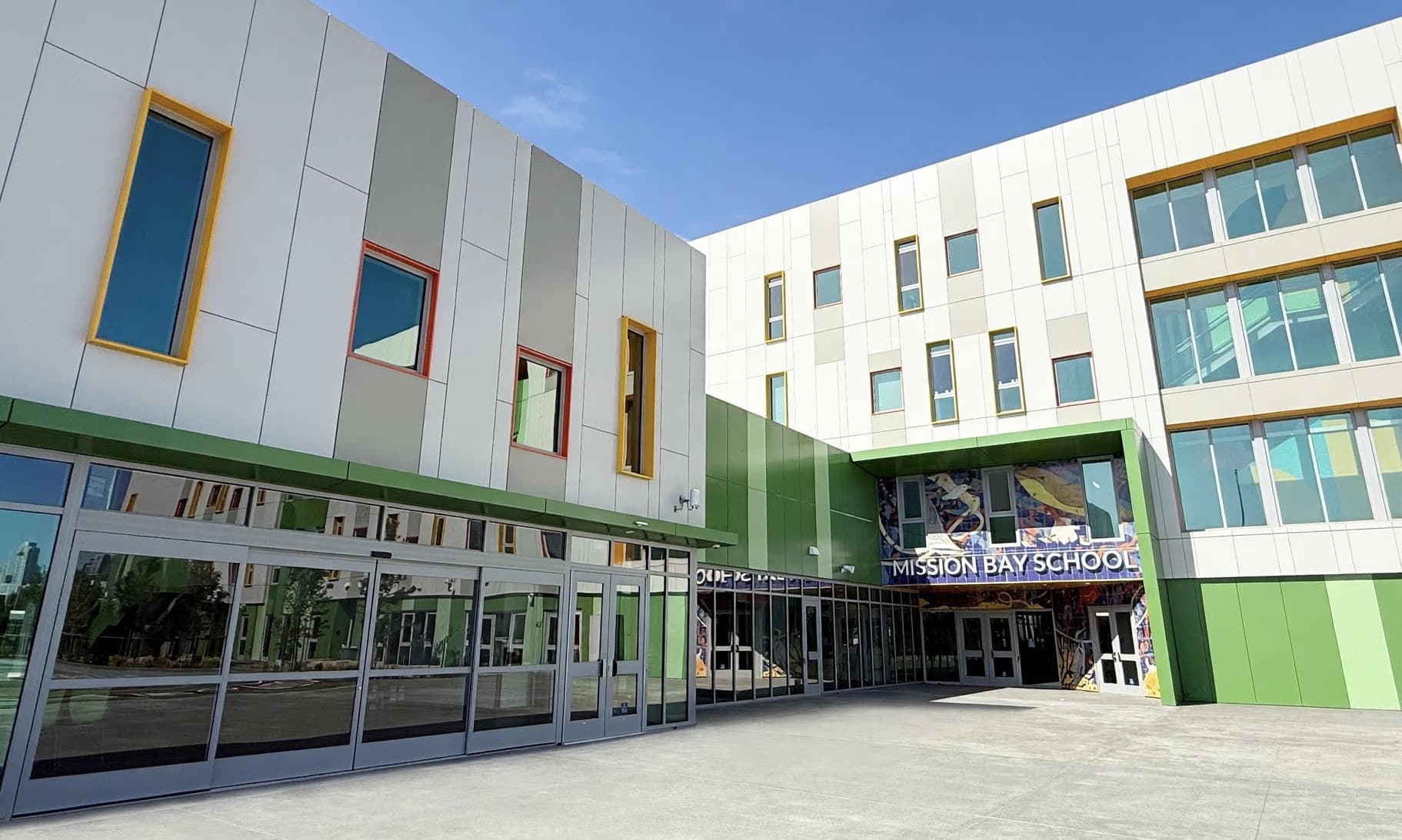 Mission Bay School's entrance courtyard, with the panelled facade and the main doors
